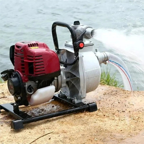 Heavy Duty Gasoline Mini Water Pump With High Lift Design And One Inch Port for efficient water movement by a riverside.