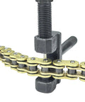 Close-up of a chain breaker tool on a 520 Beefed Up Heavy Duty Drive Chain With O Ring 120 Links Master Link for Motorcycle ATV UTV.
