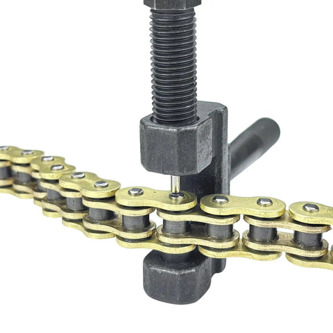 Close-up of a chain breaker tool on a 520 Beefed Up Heavy Duty Drive Chain With O Ring 120 Links Master Link for Motorcycle ATV UTV.