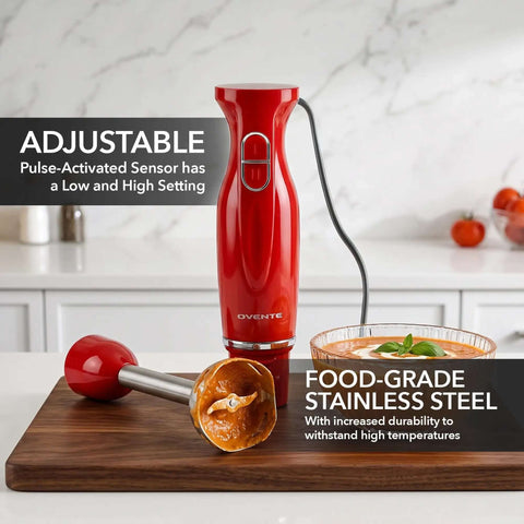 Red Corded Immersion Blender 300W with Two Speeds for Whipping Up Smoothies Sauces and Dips in a Flash on a wooden cutting board.