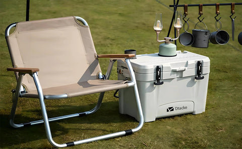 Dtacke cooler front view with rubber T-handle latches (160mm); white cooler with two front latches beside camping chair