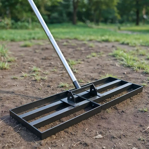 Beast Heavy Duty Lawn Leveling Rake with 30 Inch by 10 Inch head, stainless steel handle, in use on soil