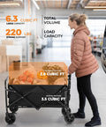 Heavy Duty Collapsible Wagon With All Terrain Wheels And Drink Holders 220 Lbs Capacity Foldable Utility Cart in use for groceries