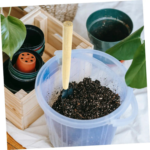 Wooden Garden Tool Handles Pack Of Five For Weeding And Mowing shown inside soil-filled bucket indoors with plant pots nearby
