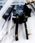 Top Shelf Four Pair Epoxy Resin Silicone Molds For Custom Bar Pull Handles And Cabinet Hardware showcasing clear and black molds with decorative gold accents.