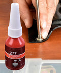 Red Thread Locker Gel For All Fasteners And Nuts, Ultra Strong Anaerobic Adhesive That Prevents Loosening From Vibration, Stops Rust, 10ml High Strength Thread Glue For Home, Auto And Industrial Use with a hand applying the gel to a metal fastener.