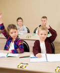 Kids in classroom with Bus Themed 24 Pack Kid Friendly School Name Plates For Desks And Cubbies Self Adhesive With Photo Space.
