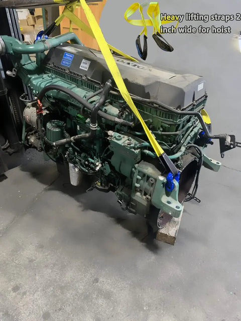 Industrial engine hoisted by 6 Ft Long By 2 In Wide Tow Strap With Reinforced Eyes, Heavy Duty Vehicle Recovery Rope, in shop setting.