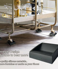 Solid Silicone Furniture Cup Stoppers 8 Pack 2x2 Inch Floor Protectors installed under furniture wheel on hardwood floor.