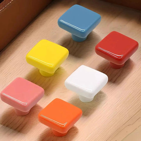 Colorful square ceramic knobs on wood surface, not 1.25 Inch Glossy Ceramic Square Cabinet Knobs White 6 Pcs Easy Install Drawer Pull Handles