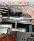 Metric tap and die wrench with knurled ends in a bench vise (close-up view)