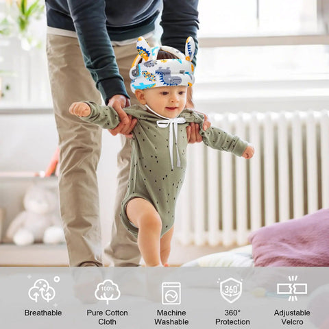 Toddler wearing a Breathable Baby Helmet For Crawling And Walking with dinosaur design, assisted by an adult, showcasing adjustable fit.