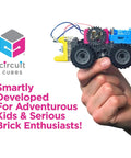 Hand holding Gears Go Multi Vehicle Mobility Launch Kit with Circuit Cubes and wheels, perfect for STEM lovers and toy rig builders.