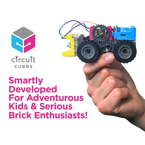 Hand holding Gears Go Multi Vehicle Mobility Launch Kit with Circuit Cubes and wheels, perfect for STEM lovers and toy rig builders.