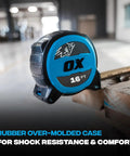 Rugged 25 Ft Tape Measure With Nylon Coated 1.25 Inch Blade, Dual Magnet Hook, Shockproof ABS Housing, Stands Out Up To 13 Ft, Magnetic Construction Tape Measure For Pros And DIY Projects on a wooden surface