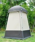 All In One Portable Outdoor Shower Tent Changing Room Privacy Shelter For Camping And Hiking gray tent in a park setting.