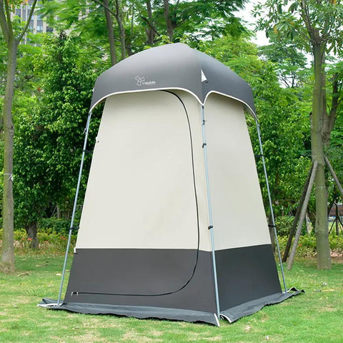 All In One Portable Outdoor Shower Tent Changing Room Privacy Shelter For Camping And Hiking gray tent in a park setting.