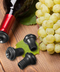 24 Piece Wine Stopper Set With Vacuum Pump And Silicone Saver Keeps Wine Fresh Sealed And Flavorful near grapes on wooden surface