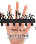Keys Please Wall Mounted Mini Key Holder Iron Black Decor Rack With Six Hooks displayed against a hand for size reference.