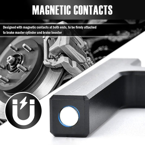 Front view of VKQTS brake booster adjustment tool; black handle with blue-ring button, rotor and caliper in background.