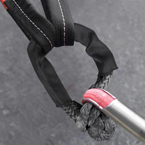 Close-up of Hella Tough Heavy Duty Soft Shackles 57K Lbs Breaking Strength showing braided synthetic material with protective sleeve.