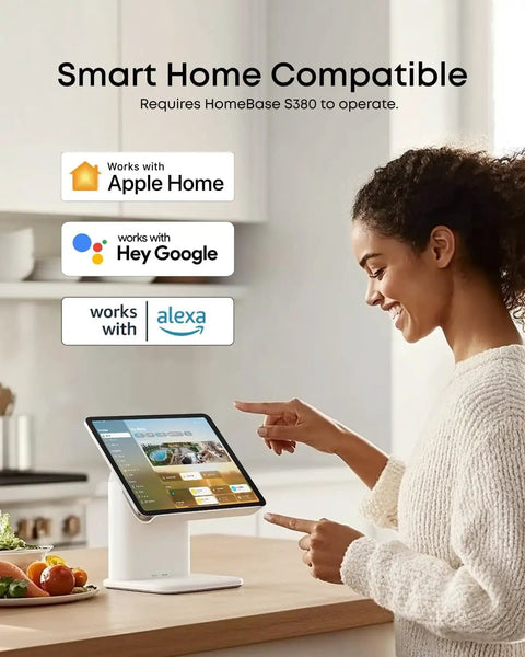 Person using a smart home tablet in a kitchen, compatible with Apple Home, Google Assistant, and Alexa for device integration.