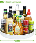 Smooth Spinning White Metal Lazy Susan Turntable Two Pack Compact Rotating Kitchen Cabinet Organizer And Countertop Rack For Pantry Storage with sauces and spices.