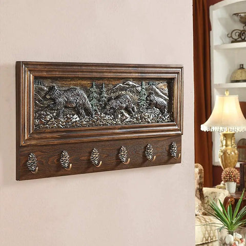 Rock Solid Wall Mounted Coat Rack Featuring Creative Embossed Design And Sturdy Zinc Alloy Hooks with bear design and pinecone hooks.