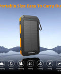 Solar Power Bank 20,000mAh Portable Charger On The Go with USB C four cables and three ports, rugged design for outdoor use.
