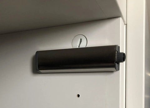 Set Of Three Push To Open Cabinet Latches With Silent Magnetic Catch For Dead Simple Drawer Opens Light Finger Tap Action Silver kitchen latches mounted on cabinet.