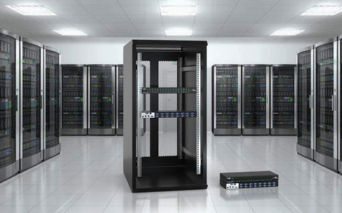 No Sweat 16 Port IP KVM Switch And Rackmount KVM Console in a server room with multiple racks in the background.