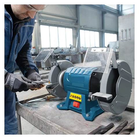 Heavy Lifter Dual Wheel Bench Grinder With Rock Solid Stability For Deburring Sharpening Steel And Aluminum Shop Grade Vertical Tool With 600 Watt Motor in use on a workbench.