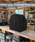 Shop Ready Heavy Duty Power Miter Saw Cover Shields Your Table Saw From Sticky Resin And Dust Bunnies While Keeping The Garage Squeaky Clean With The Top Carry Loop And Snag Free Drawstring on a workbench.