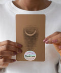 Person holding Thank You Stickers for Packaging and Gift Wrapping on copper plate with self adhesive sealing labels shown.
