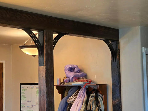 Heavy Duty Shelf Brackets Set Of 2 16 By 12 Inch 1100 Lbs Max Load Rustproof Die Cast Alloy Mantel Brackets For Ultra Strong Wood Shelves Supports 16 To 24 Inch Deep Shelves 90 Degree Mount installed under wooden beam supporting a shelf
