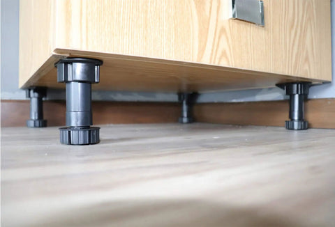 Close-up of 12 Pack Black Cabinet Leveler Legs Adjustable Furniture Feet Elevate Cabinets From Three And Seven Eighths Inches To Five And One Eighth Inches