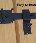 Six Inch Heavy Duty Barn Door Flip Latch With 360 Degree Rotatable Gate Lock installed on wood, matte black steel finish.