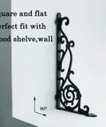 Rock Solid Decorative Shelf Brackets Wrought Iron Corbels 15.5 X 7.2 In Antique Black side view on white wall.