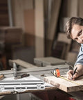 Solid Aluminum Tool Box Featuring A Slick Padded Interior And Extra Sturdy Reinforced Handle on a workbench with tools.