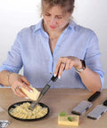Person using Three Piece Grater And Zester Set With Fine Coarse And Extra Coarse Holes Stainless Steel Dishwasher Safe on cheese