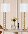 Gold Buffet Lamps Set Of 2 Tall Skinny Candlestick Style Lamps For Living Room And Dining Room on a white table