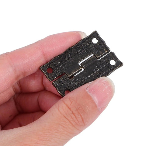 Vintage Printed Antique Cabinet Hinges 10 Pack for Small Jewelry Boxes shown in hand