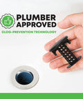 Matte Black Bathroom Sink Hair Catcher That Snaps Right In And Grabs Every Loose Strand, hand holding hair catcher above sink drain.