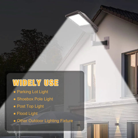 Beefy Heavy Duty 90 Degree Wall Mount Bracket with 2-3/8in OD Tenon installed on building, illuminating with LED light, dark bronze finish.
