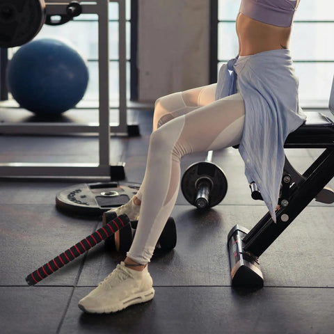 Person seated on gym bench holding Barbell Connector Replacement Rod For Dumbbells Secure Foam Grip Handle And Plastic Bar Weightlifting Gear