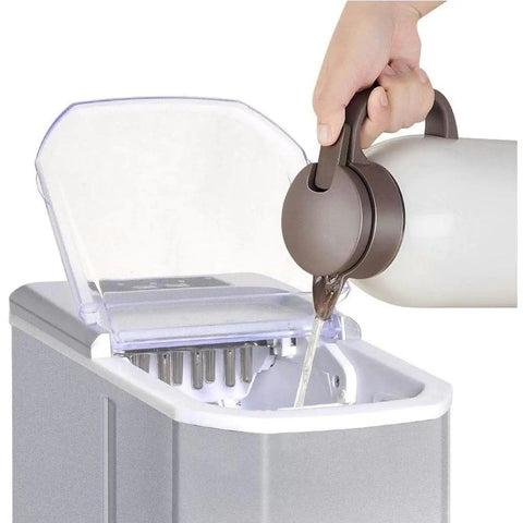 Portable Slick Countertop Ice Maker With Fast Bullet Ice Cubes Ready In Eight Minutes and 33 Pounds Daily For Kitchen Bar Or Game Room Chill Setup filling with water.