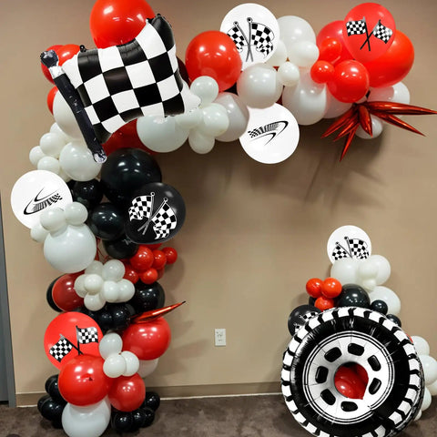 Lit Race Car Balloons Checkered Flag And Tire Balloons Red Black White Latex 12 Inch 35 Piece Party Decor Kit displayed indoors