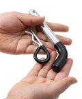 Heavy Duty Trailer Hitch Pins And Clips Four Pack, 5/8 Inch Diameter With Rubber Coated Black Grip, held in hands