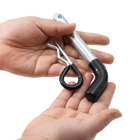 Heavy Duty Trailer Hitch Pins And Clips Four Pack, 5/8 Inch Diameter With Rubber Coated Black Grip, held in hands