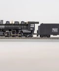 Side view of Two Six Two Steam Locomotive With Smoke Unit And Tender For HO Scale Boston And Maine Railroad Model on track